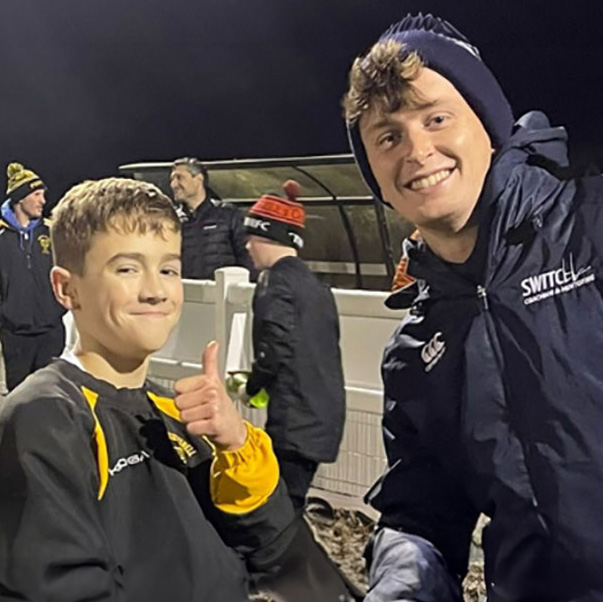 RFU qualified coach Lawrence Gill having his photo taken with a young player at a Switch Rugby session