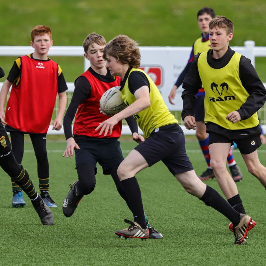 young switch rugby academy players training on the field