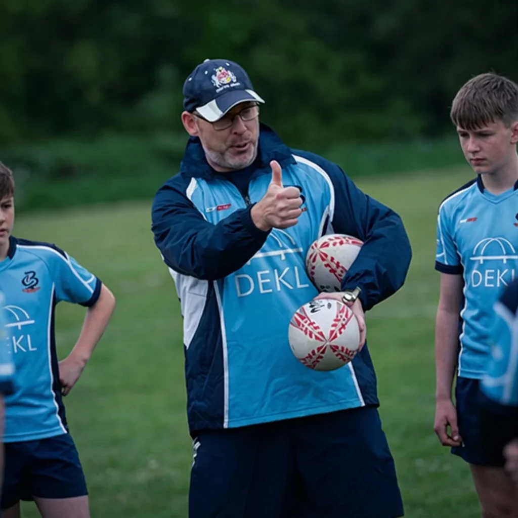 City of Bristol Rugby U16 head coach delivering technical instruction during elite youth rugby training session in Bristol