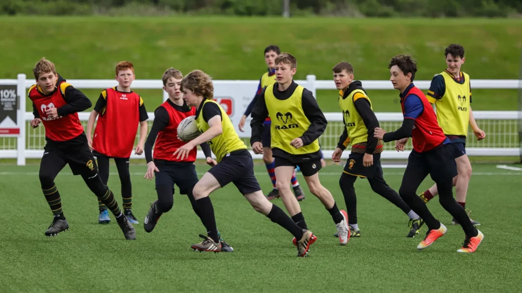 young switch rugby academy players from various schools across Bristol training on the field